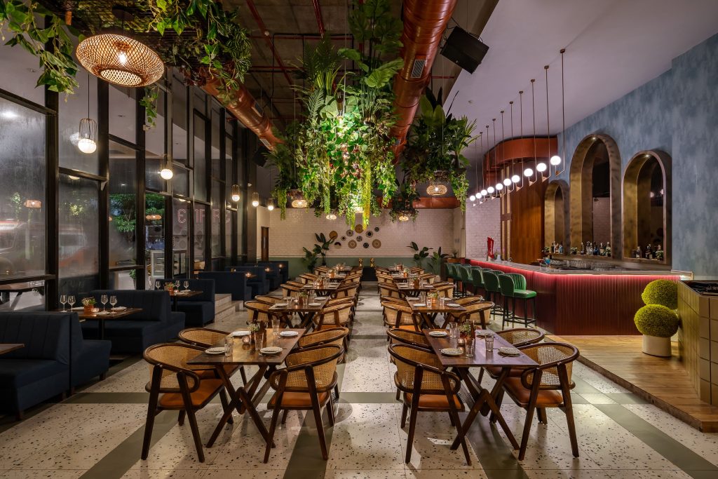 Make big biophilic statements inside Mumbai's boho bistro - Architect ...