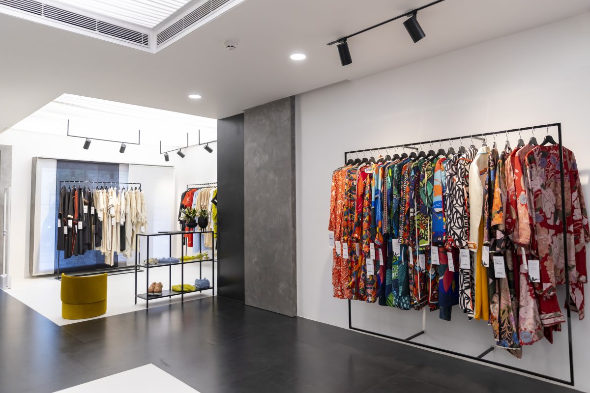 Modern fashion boutique showcases elegant clothing collection in